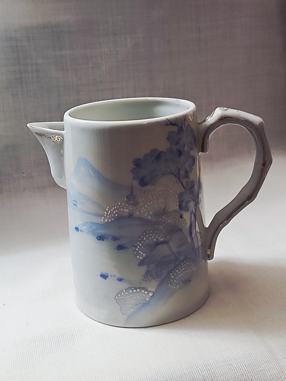 Vintage Blue and White Porcelain Pitcher with Gilded Accents